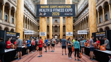Runners collecting race packets at the Marine Corps Marathon Health and Fitness Expo 2026 inside the National Building Museum, Washington DC