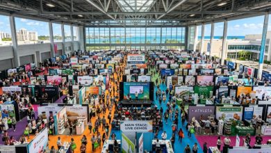 Aerial view of a busy health and wellness expo floor with exhibitor booths and visitors at Miami Beach Convention Center in November 2026